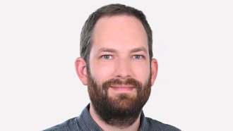 Freek van Ede is facing the camera with a slight smile on his face. He has brown hair and full brown beard. He appears to be wearing a collared button up shirt, but we can't quite tell because the photo cuts off at his shoulders.